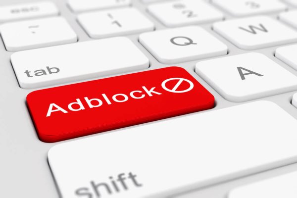 the word "adblock" on a red enter key on a keyboard