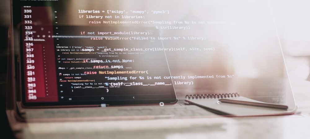 code displayed on a faded laptop screen
