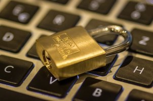 gold padlock on keyboard