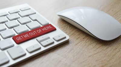 white keyboard and mouse; keyboard has a red enter button saying get me out of here