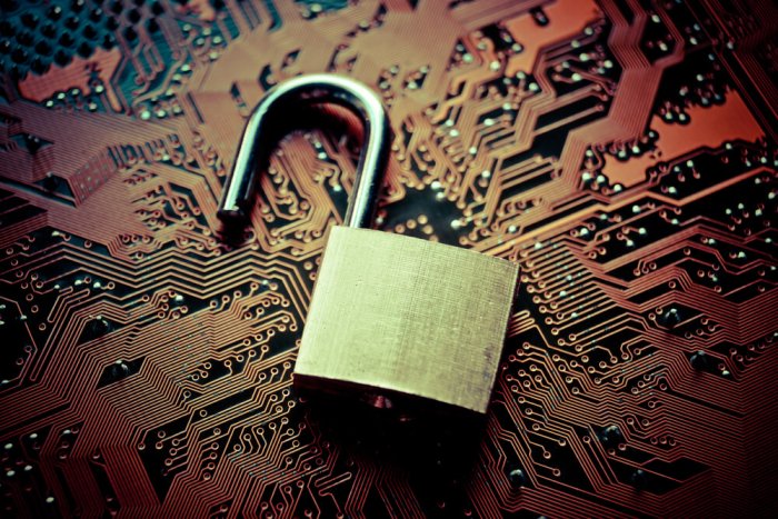 padlock on a orange circuit board