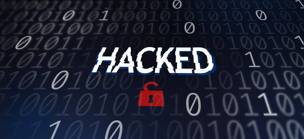 word "hacked" on a dark blue tech background