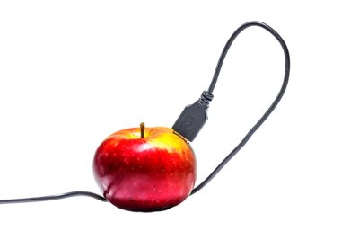 usb cord plugged into red apple