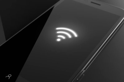 white wifi symbol on a black phone